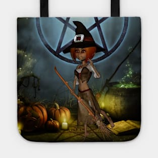 Cute little witch with pumpkin in the night Tote