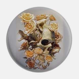 Human skull with snake heads surrounded by dry roses. Pin