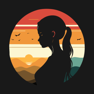 A T-shirt featuring a silhouette of a girl and stunning colors inspired by the sunset. T-Shirt