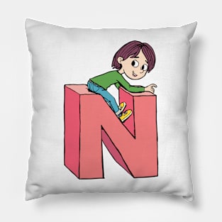 boy is playing on the capital letter N Pillow