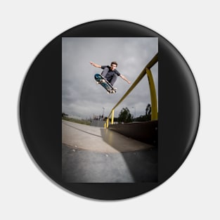 Skateboarder doing a ollie Pin