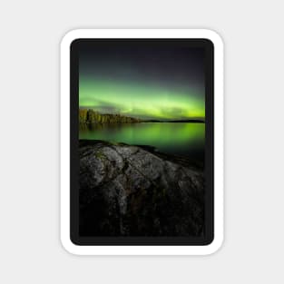 Northern lights glowing over lake in Finland Magnet