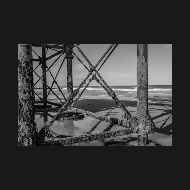 Jetty metal work on a sandy beach by yackers1