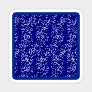 Blue background with white swirls. Magnet