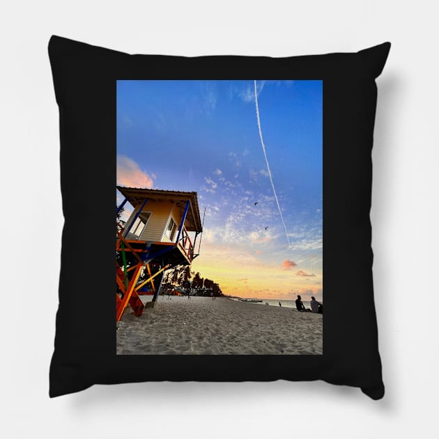 A sun-drenched beach with a crystal-clear ocean stretching out to the horizon. Pillow by Dicaribe