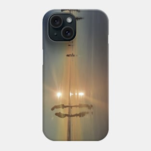 Silhouetted people in a row on a sand beach. Phone Case