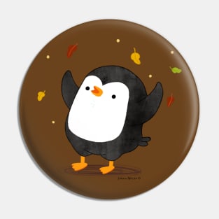 Penguin having fun with autumn leaves Pin