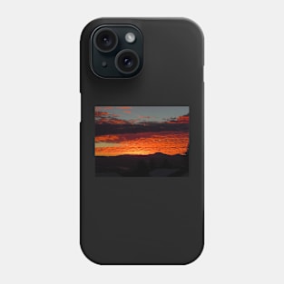 Burnt orange sunset reflecting off the clouds Phone Case