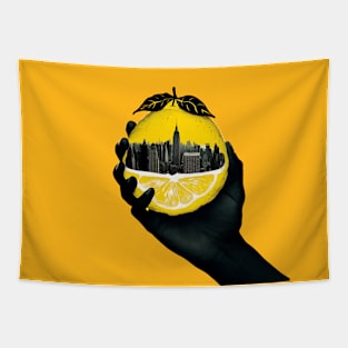 A hand holding a city inside a lemon Tapestry