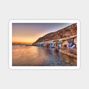 Sunset at the fishermen houses with the impressive boat shelters, also known as “syrmata” in Klima of Milos, Greece Magnet