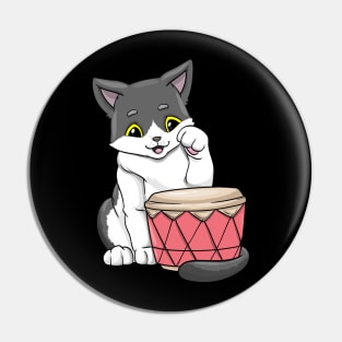 Beautiful cat is playing the drum Pin