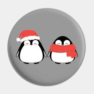 Couple of cute penguins, friends in winter Christmas red hat and scarf. Pin