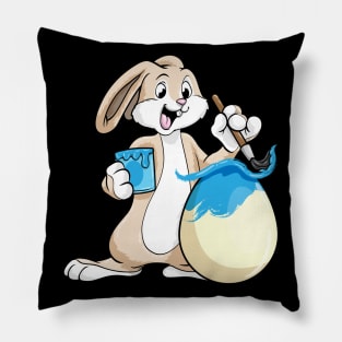 Funny bunny is painting an easter egg Pillow