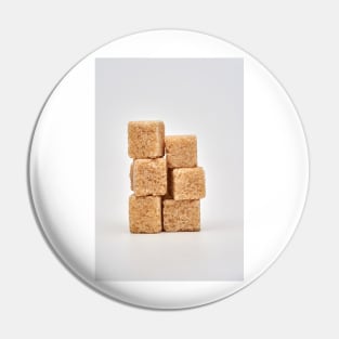 Closeup of brown sugar cubes on white Pin