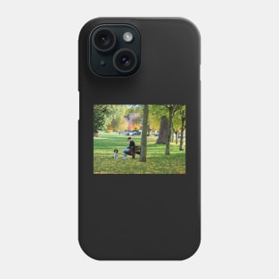 Young woman with her dog and phone in the park Phone Case