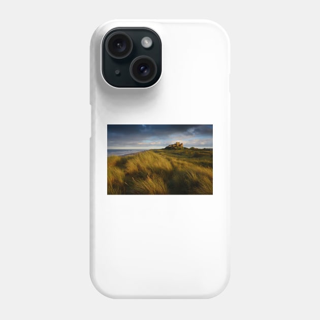 Bamburgh Castle at sunset Phone Case by chrisdrabble