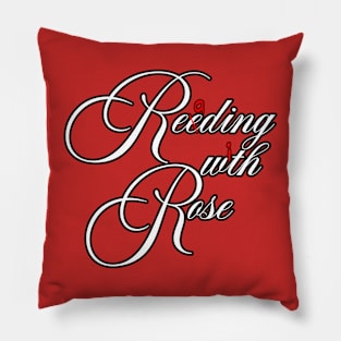 Reeding wth Rose Pillow