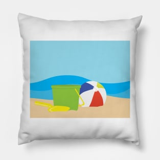 Green toy bucket, Yellow shavel and beach ball on Brown sand and Blue sea background Pillow