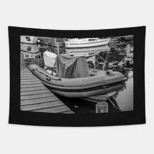 Inflatable dinghy moored up on the Norfolk Broads Tapestry