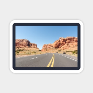 Yellow lines down middle of road through desert Magnet