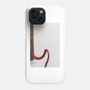 Red electric guitar close-up against white raw wall Phone Case