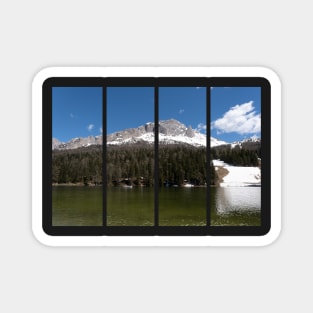 The fabulous alpine lake of Misurina in the Dolomites. Boat on the water. Lovely and relaxing place in the Italian Alps. Reflections in the rippled water. Sunny spring day. Magnet