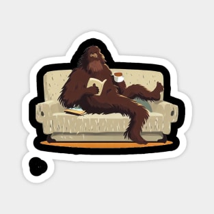 Bigfoot sit on sofa, read a book and drink coffee Magnet