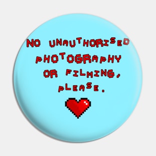 No unauthorised photography or filming, please. Pin