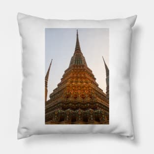 Low angle view of a Buddha stupa reaching symmetrical in the clear sky. Pillow