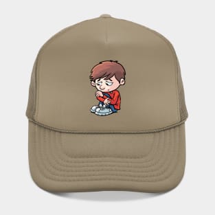 sad and depressed boy sits curled up on the ground Hat