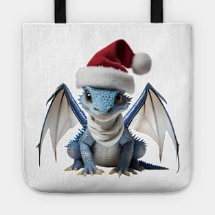 Cute Blue Baby Dragon Wearing a Red Festive Christmas Hat Tote