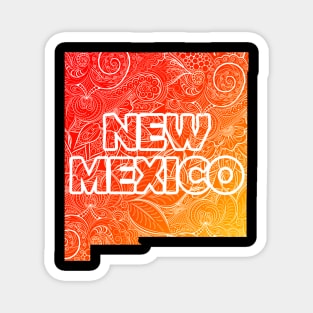 Colorful mandala art map of New Mexico with text in red and orange Magnet