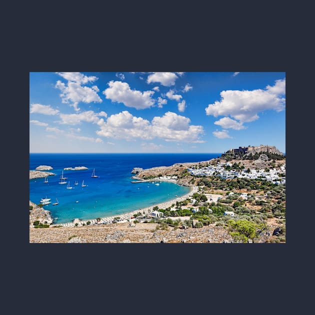 The village of Lindos with a beautiful bay, medieval castle and pictursque houses on a hill is the star of Rhodes, Greece. by Constantinos Iliopoulos Photography