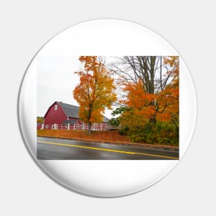 Traditional American style red barn from passing highway in fall with bright foliage in rural USA Pin