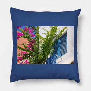 Pink bougainvillea climber and blue shutters in Greece. Pillow