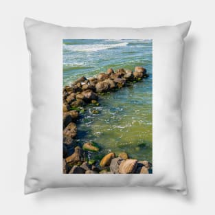 Sea water breaking on the stone groyne Pillow