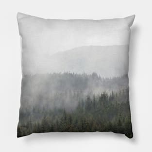 Mist and rain floats across trees in the Scottish Highlands Pillow