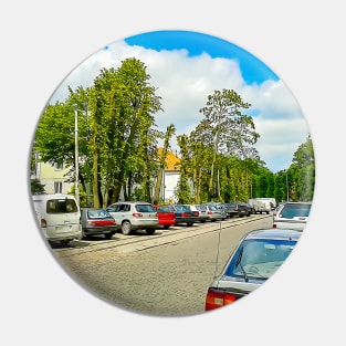 Street of the city. Parked cars. Clear weather. Tram rails Pin