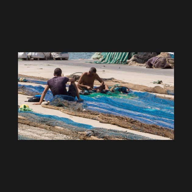 Mending fishing nets. by sma1050