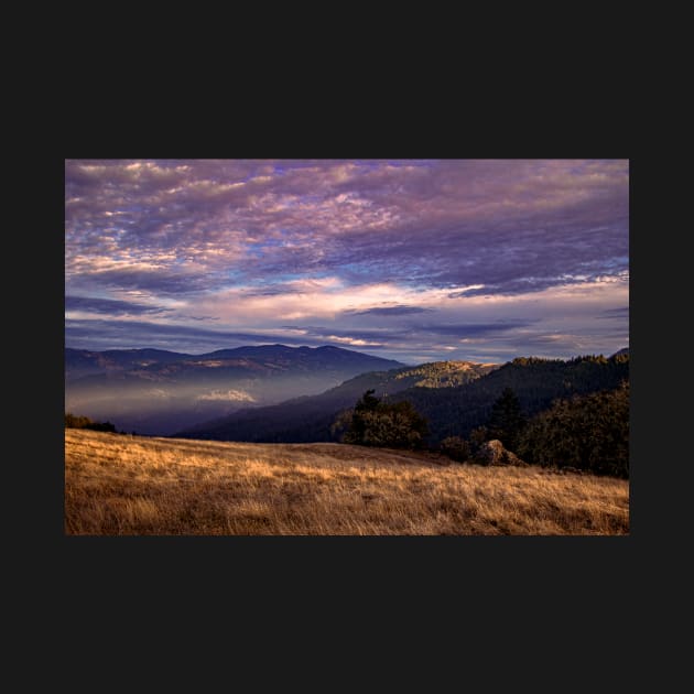 Sunset clouds over mountains by blossomcophoto