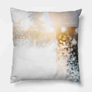 Child walking in snow during golden hour Pillow