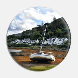 A yacht at rest on the shoreline at Lochranza Pin