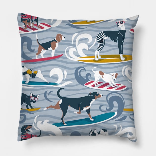 Happy dogs catching waves // pattern // pastel blue background darker blue waves brown white and blue doggies yellow red and turquoise surf and bodyboards Pillow by SelmaCardoso