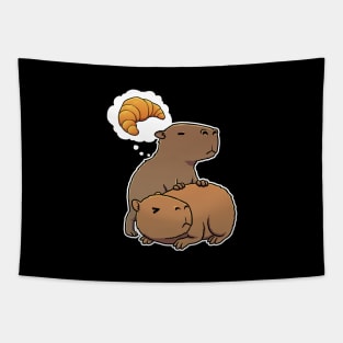 Capybara hungry for Croissant Pastry Tapestry