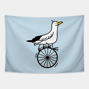 Funny seagull is riding a unicycle Tapestry