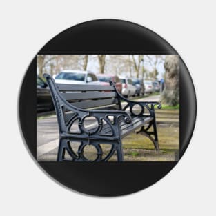 Bench for people to sit along the Thames river embankment in Windsor, Berkshire, England, UK Pin