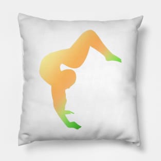 A contortionist in an arched handstand Pillow