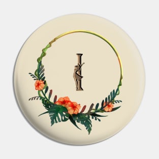 Tropical flowers on a circle frame around letter I and girl figure Pin