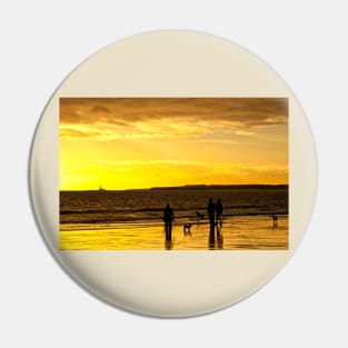 Dog walkers on the beach at sunrise Pin