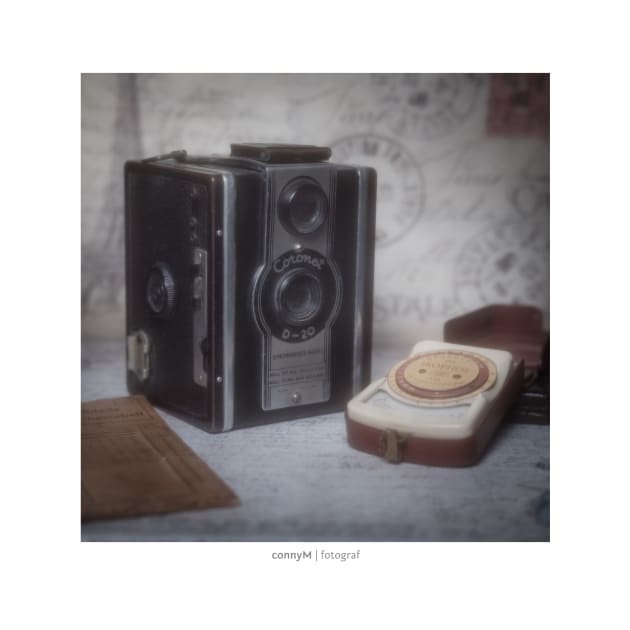 An old vintage camera with external exposure meter, as a poster by connyM-Sweden